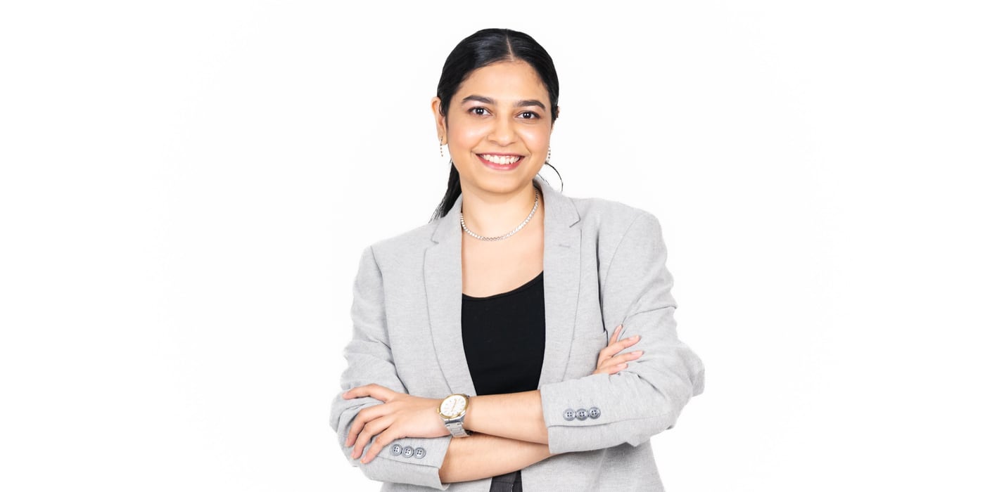 Naveena Srinivasan smiling warmly