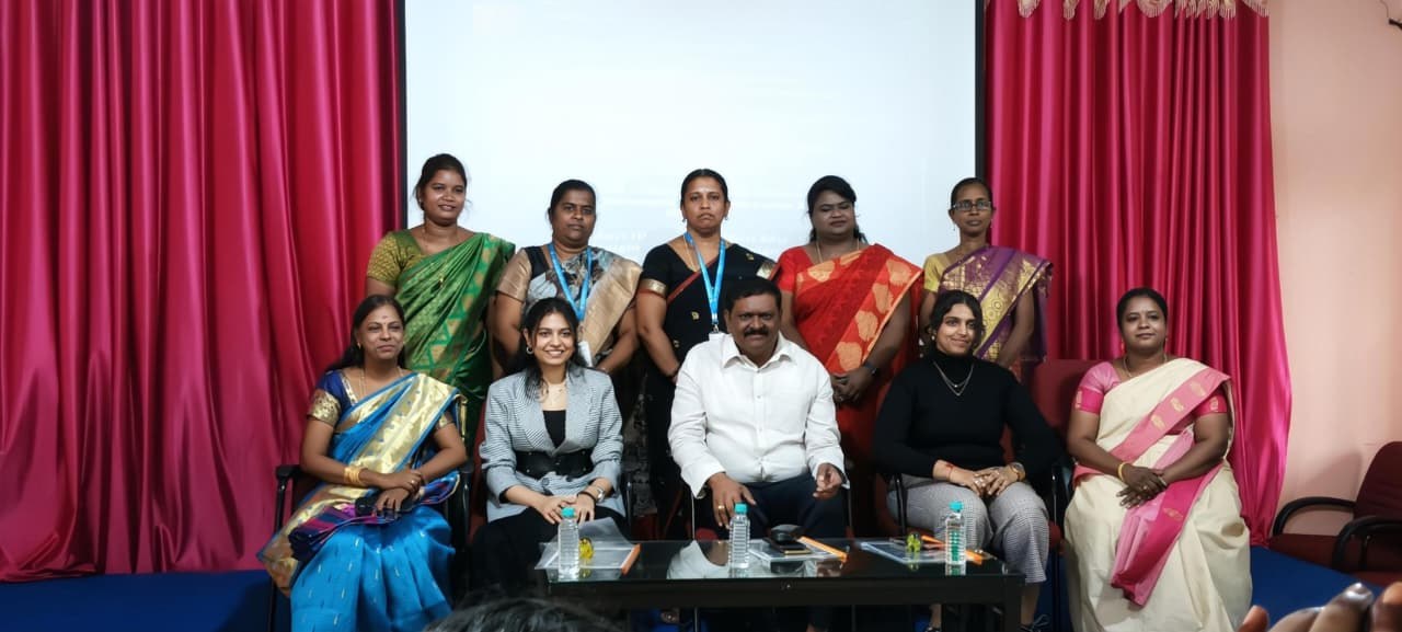 Naveena Srinivasan seated with faculty and organisers after a workshop